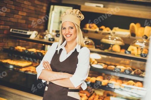 Preview: Beautiful young woman smiling confidently posing in her baker shop