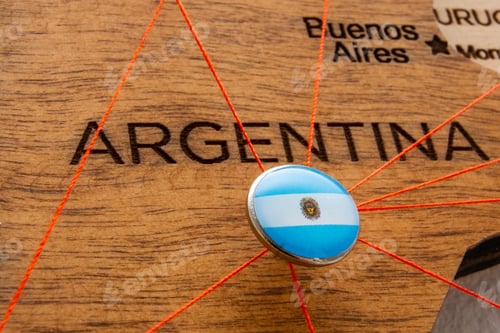 Preview: Argentina flag on the pin with red thread showed the paths on the wooden map.