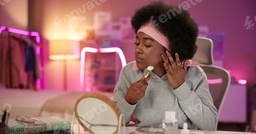 Preview: Face roller, night and skincare with black woman in bedroom for beauty routine, lymphatic drainage
