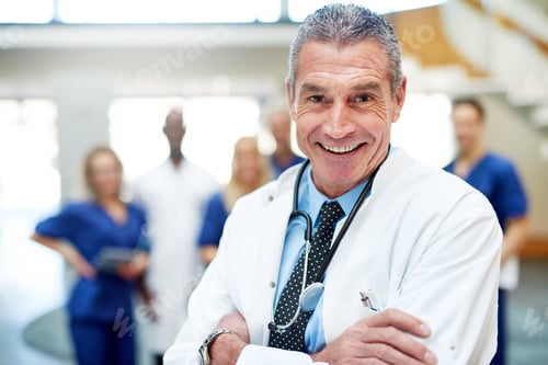 Preview: Medical specialist smiling standing with arms crossed