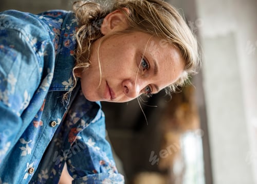 Preview: Closeup of caucasain woman working face thoughtful expression