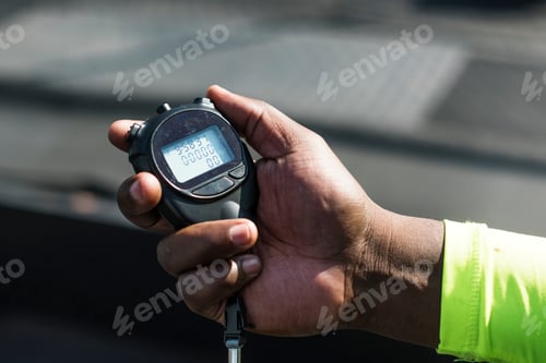 Preview: Closeup of hand holding stopwatch