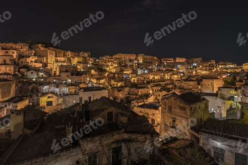 Preview: Stunning aerial view of the historic Matera skyline illuminated by lights