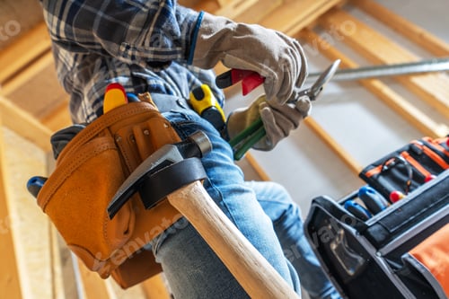 Preview: A Carpenter Prepares Tools While Working on a Construction Project in a Home Under Renovation