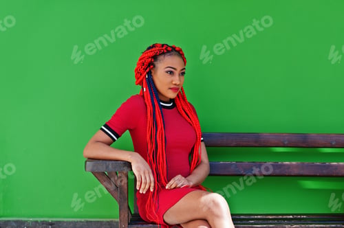 Preview: African american girl in red dress with dreadlocks