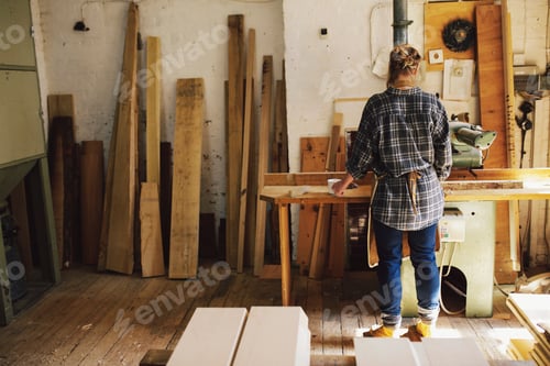 Preview: Young craftswoman at workbench in pipe organ workshop