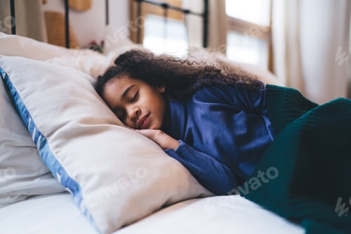 Preview: Dreamy cute little girl sleeping on cozy bed