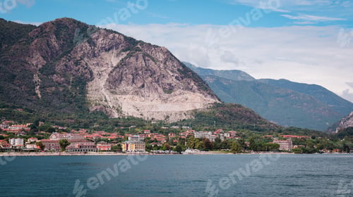 Preview: Picturesque view of Lake Maggiore with mountains and charming towns under clear skies