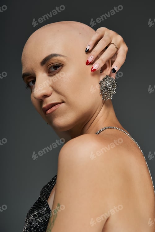 Preview: Elegant bald woman embraces her beauty in artistic portrait showcasing her confidence and style