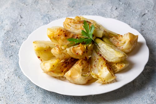 Preview: Organic Baked Fennel Bulbs with Salt and Pepper. Fennel dish with olive oil.