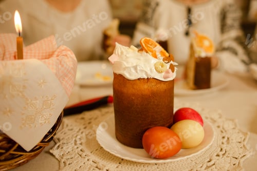 Preview: Easter cake with eggs on table on background of family traditional celebrating
