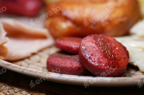 Preview: Delicious grilled sausage served on a rustic plate during breakfast