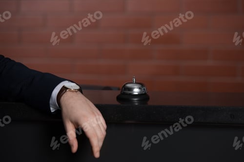 Preview: cropped shot of businessman leaning on hotel reception desk