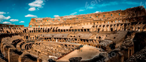 Preview: Scenic view of the famous Coliseum in Rome, Italy under a blue sky background