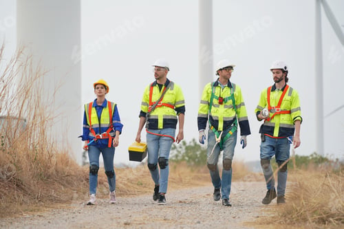 Preview: Sustainable energy industry - Engineers working at alternative renewable wind energy farm
