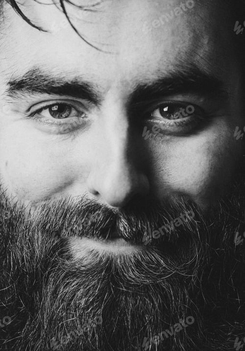 Preview: Super close up of a black and white portrait of a young hipster male smiling to camera