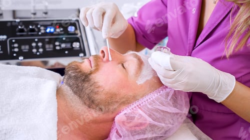 Preview: White middle-aged man getting beauty treatment therapy.