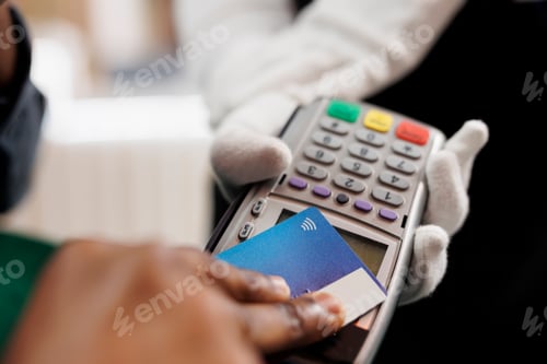 Preview: Male hand making contactless payment