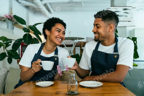Preview: Barista and waiter working in a bar cafeteria shop