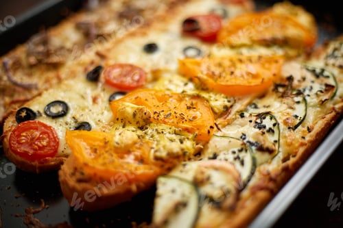 Preview: Long baguettes pizza sandwiches with tuna, mushrooms, tomatoes and cheese on a metal baking tray