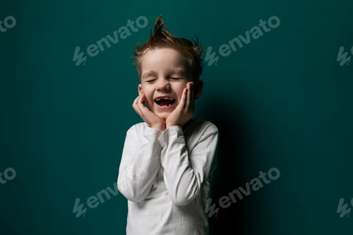Preview: Little Boy Standing in Front of Green Wall