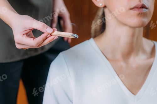 Preview: Peaceful Woman Sitting and Meditating, Spiritual Coach with Palo Santo Stick.