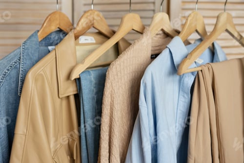 Preview: Trendy capsule wardrobe in beige and light blue on a rail rack