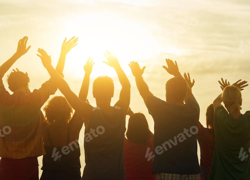 Preview: Hands up against sunset background.