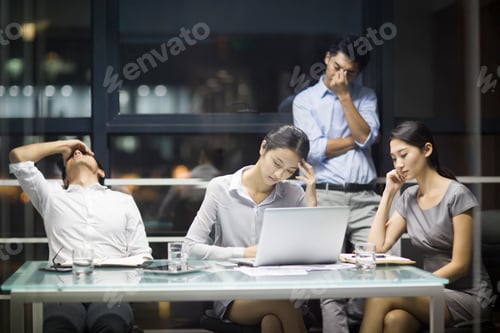 Preview: Tired business people having a meeting