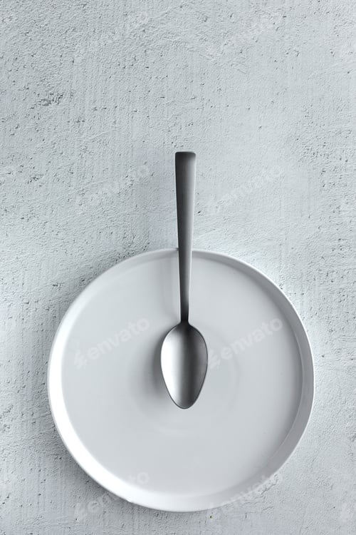 Preview: From above picture of composition of white dish and cutlery
