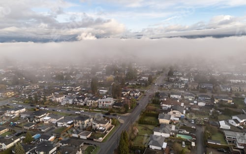 Preview: Aerial View of Urban Neighborhood Beneath Low Clouds in Burnaby, BC, Canada
