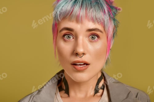 Preview: Young woman with vibrant short hair in a creative studio setting