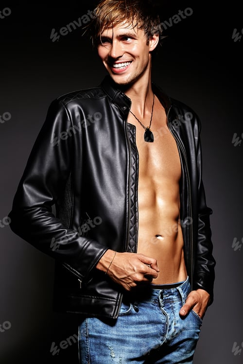 Preview: Portrait of young handsome man posing in studio