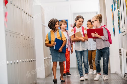 Preview: cute funny pupils running through school corridor