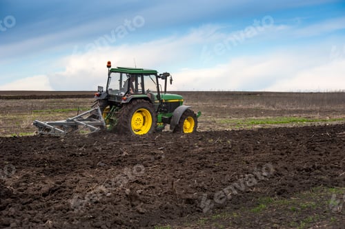 Preview: a tractor with a homemade plow prepares the field for sowing