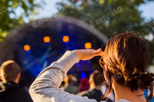 Preview: Woman watching at stage during festival