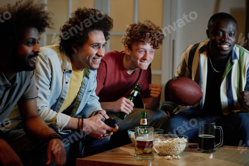 Preview: Cheerful Men Watching Football Game