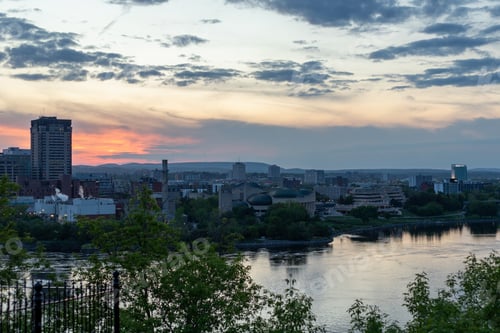 Preview: Sunset sky over Gatineau skyline and Ottawa River in Canada.