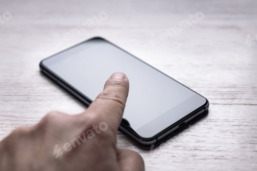 Preview: finger touching the screen of a smart phone