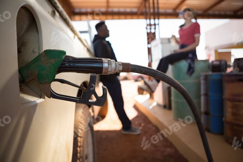 Preview: Automatic nozzles filling petrol into car tank