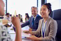 Preview: Multi-Cultural Business Team Meeting And Collaborating Around Table In Modern Office Building