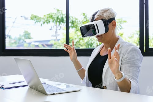 Preview: Business Woman in VR headset. Woman using VR glasses for online game.