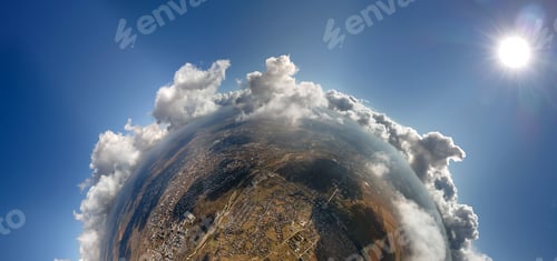 Preview: Aerial view from high altitude of little planet with distant city