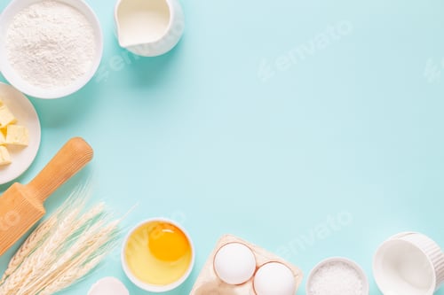 Preview: Ingredients for baking on light blue background.