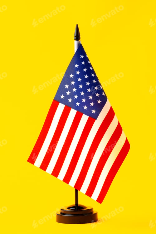 Preview: United States Flag Standing on Bright Yellow Background