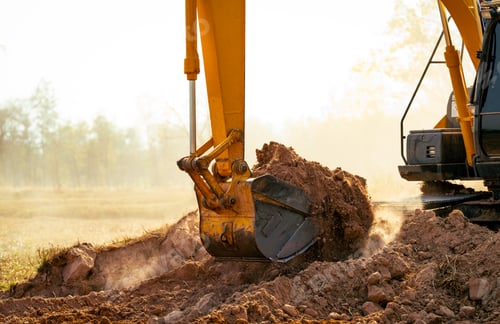 Preview: Backhoe working by digging soil at construction site. Crawler excavator digging on demolition site.