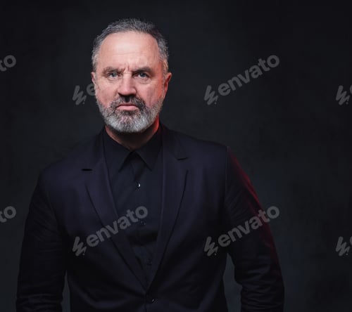 Preview: Aged businessman dressed in elegant black coat and shirt