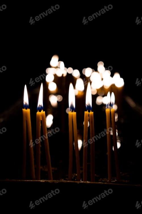 Preview: Lit church candles in the temple.