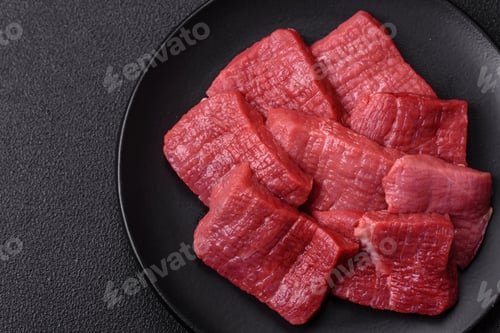 Preview: Juicy fresh raw beef meat with salt, spices and herbs