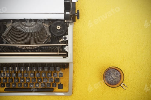Preview: Vintage typewriter on yellow background